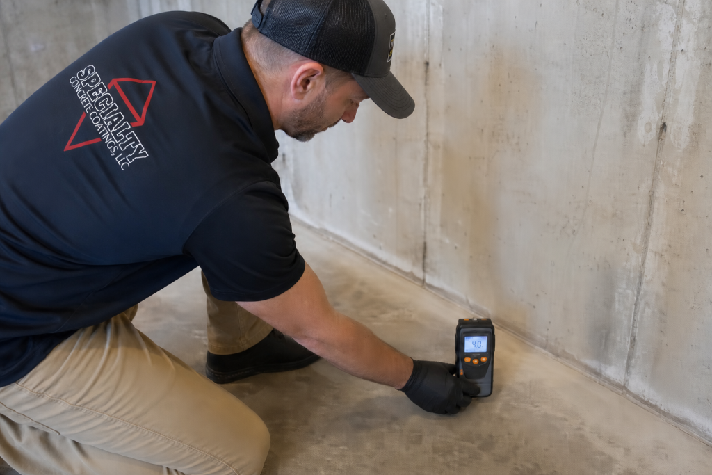 Damp basement floor with moisture problems in a Western Pennsylvania home before floor coating installation